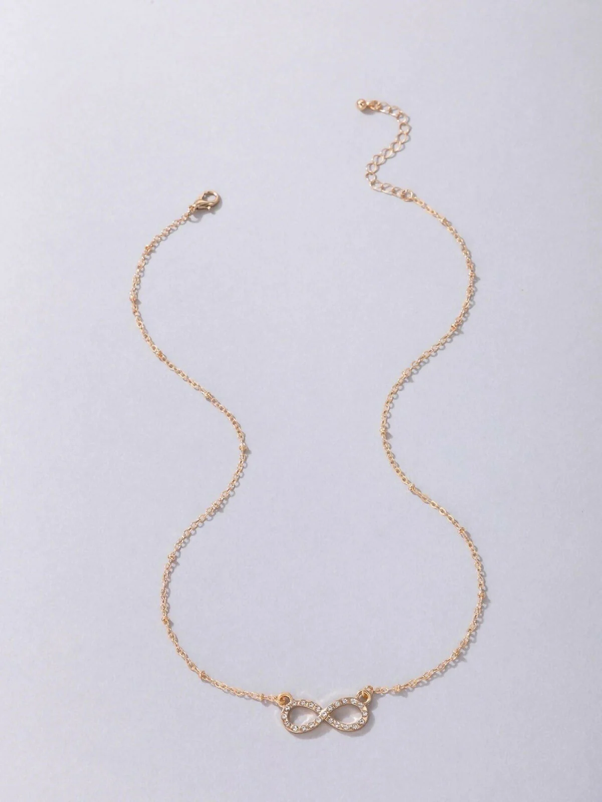 Charming 2-Piece Gold Layered Necklace Set with Infinity & Cute Pendant - Image 3